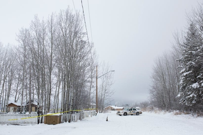 RCMP remain on scene of the house where the bodies of two brothers were found after a shooting last Friday in La Loche, SK. (Photograph by Chris Bolin)