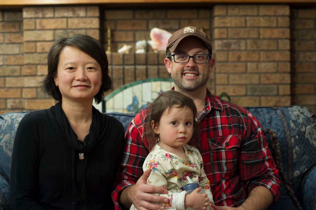 MACLEANS-SYRIAN SPONSORSHIP-11.22.15-MILLBROOK, ON: Salaam Peterborough sponsorship group member Phung Tran, a biologist for the MNRF, with husband, Brad Steinberg, and daughter Annie. (Photograph by Cole Garside)