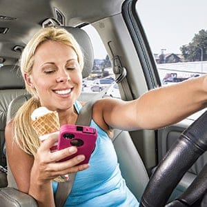 Distracted mom drives minivan (William Howard/Getty Images)
