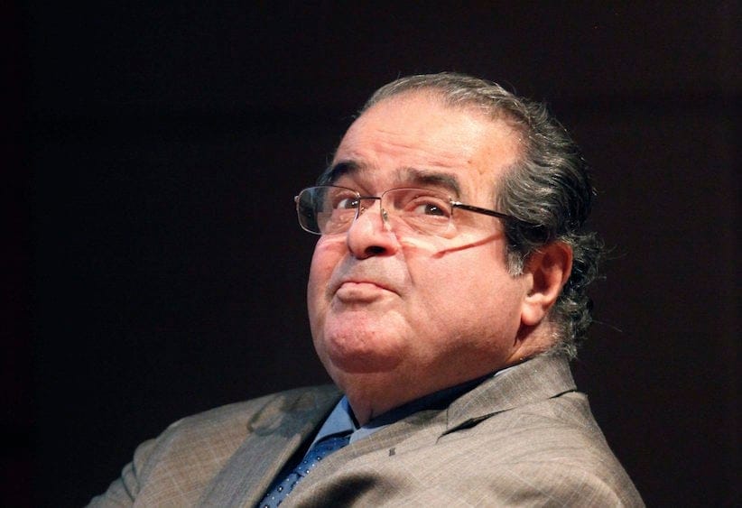 In this Oct. 18, 2011 file photo, U.S. Supreme Court justice Antonin Scalia looks into the balcony before addressing the Chicago-Kent College Law justice in Chicago. (AP Photo/Charles Rex Arbogast, File)
