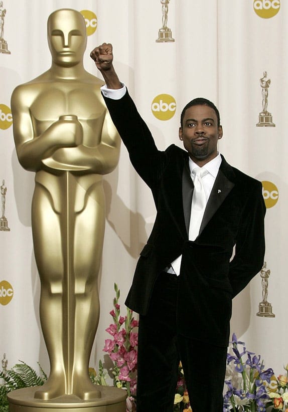 Comedian Chris Rock pumps his fist backstage after hosting the 77th annual Academy Awards in Hollywood, February 27, 2005. (Robert Galbraith/Reuters)