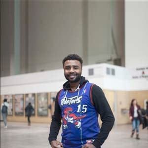 Jerry Anim-Ansah of Toronto wears a Vince Carter Raptors jersey at the Enercare Centre on the second day of the NBA All-Star weekend in Toronto on Saturday, Feb. 13, 2016. Anim-Ansah owns three jersey says he's the biggest raptors fan. He owns jersey to represent the city and team he supports. Photo by Hannah Yoon