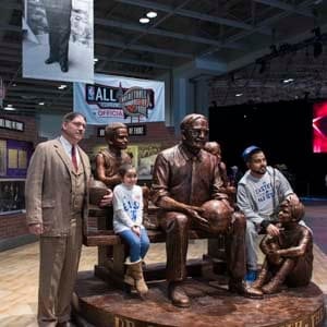 A Dr. James Naismith impersonator poses with a few fans at the Dr. James Naismith statue at the Enercare Centre on the last day of the NBA All-Star weekend in Toronto on Sunday, February 14, 2016. Naismith is a Canadian who founded basketball in 1891 because he needed an activity for students to do indoors because of the cold weather. (Photograph by Hannah Yoon)