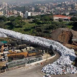 A general view of waste piled up along a street in the northern Beirut suburb of Al Fanar, Lebanon, 26 February 2016. The Lebanese cabinet reportedly canceled plans to export the garbage to Russia, causing the waste crisis to return to its starting point. The crisis led to the eruption of mass protests in summer 2015 which were organized by activist groups demanding the government to find a solution as well as to solve other problems. (Nabil Mounzer/EPA)