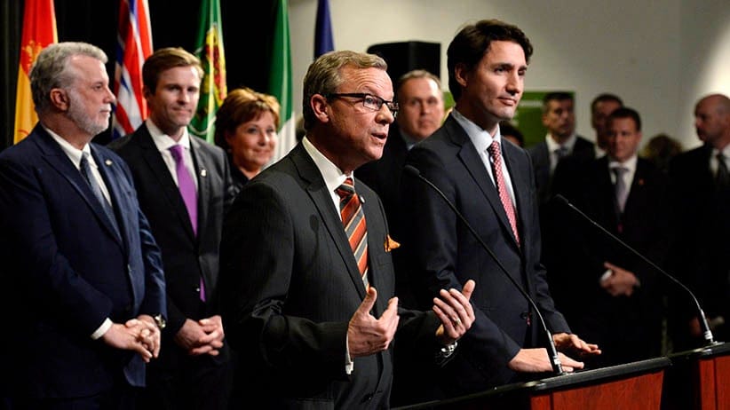 Saskatchewan Premier Brad Wall (centre) speaks following the family photo op during a First Ministers meeting at the Canadian Museum of Nature in Ottawa on Monday, Nov. 23, 2015. (Adrian Wyld/CP)