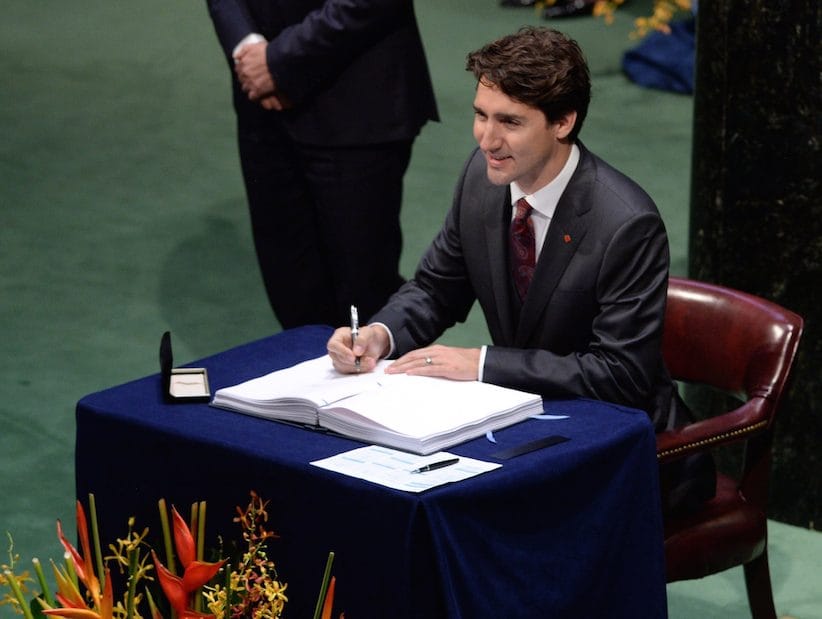 Prime Minister Justin Trudeau signs the Paris Agreement on climate change during a ceremony at the United Nations headquarters in New York on Friday, April 22, 2016. THE CANADIAN PRESS/Sean Kilpatrick
