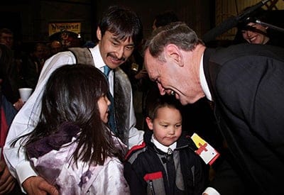 Prime Minister Jean Chretien (right) greets Nunavut premier Paul Okalik (centre) and his children Shasta (left) and Jordan following the inaugral event in Iqaluit, Nunavut Thursday, April 1, 1999. Nunavut officially became Canada's newest territory Thursday. (Kevin Frayer/CP)