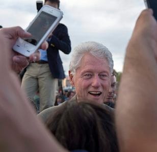 Former President Bill Clinton greets people after a rally for his wife Democratic presidential candidate Hillary Clinton at the Plaza de Espanola in Espanola, N.M., Tuesday May 24, 2016. Bill Clinton pleaded with several hundred Democrats in northern New Mexico to send his wife "to the convention with the wind at her back," repeating the refrain, "We can do this." (Eddie Moore/The Albuquerque Journal via AP) MANDATORY CREDIT