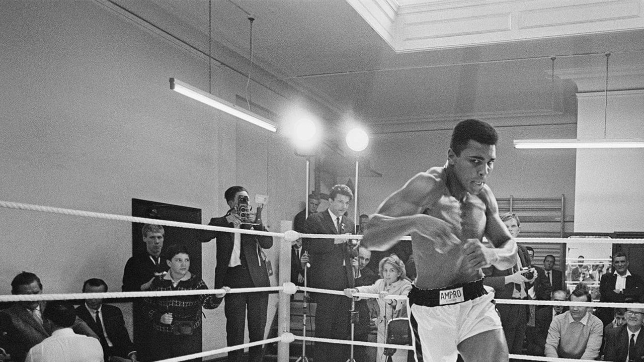 American heavyweight boxer Muhammad Ali throws bare-handed punches in the ring while in training for his fight against Brian London, London, England, August 1966. (R. McPhedran/Hulton Archives/Getty Images)