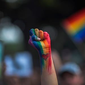 A defiant fist is raised at a vigil for the worst mass shooing in United States history on June 13, 2016 in Los Angeles, United States. A gunman killed 49 people and wounded 53 others at a gay nightclub in Orlando, Florida early yesterday morning before suspect Omar Mateen also died on-scene. (David McNew/Getty Images)