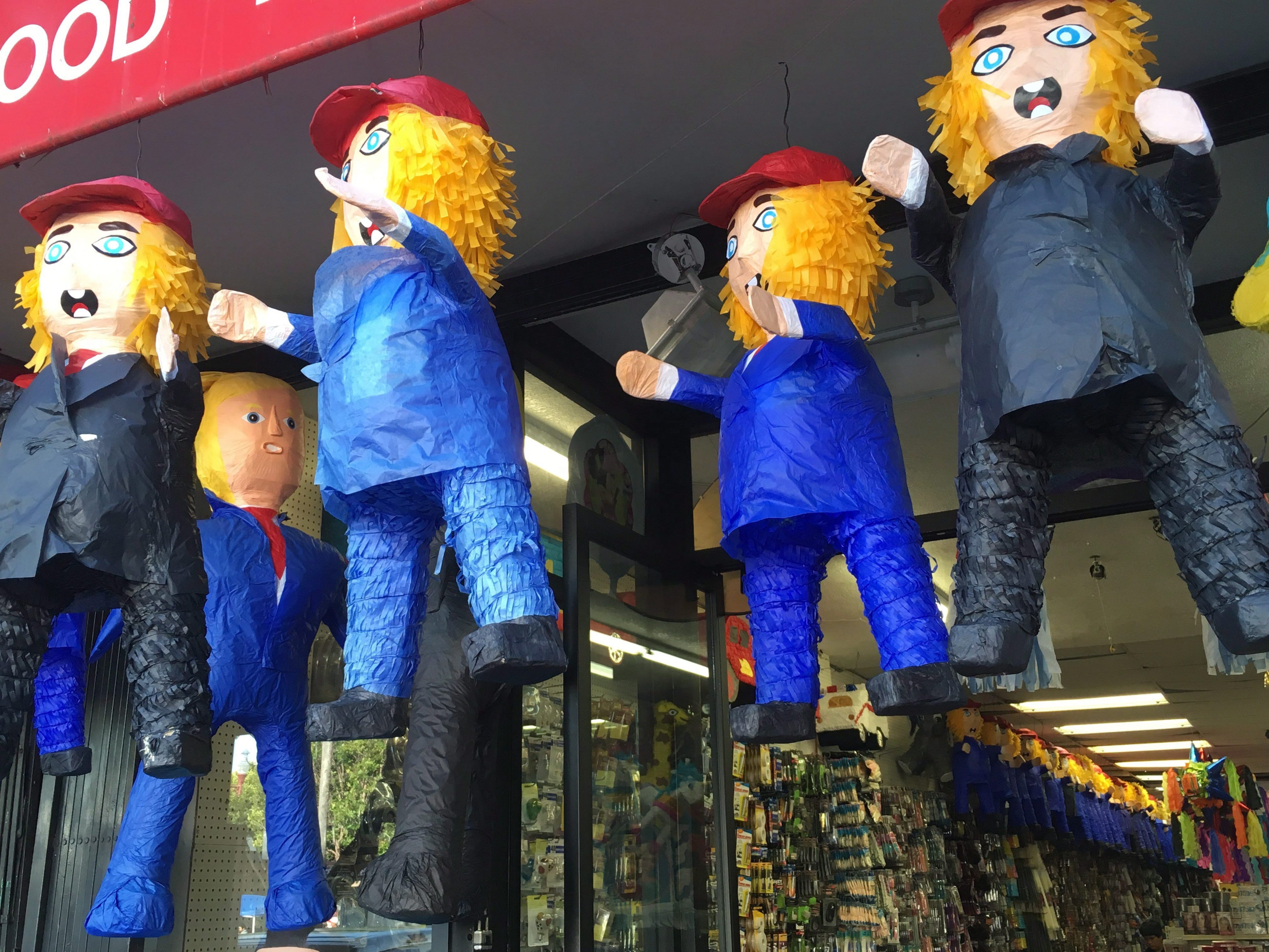 Donald Trump pinatas hang outside of Discount City, a general store in a Latino neighbourhood of San Francisco where they're the top-selling pinata, on Sunday, May 29, 2016. THE CANADIAN PRESS/Alex Panetta