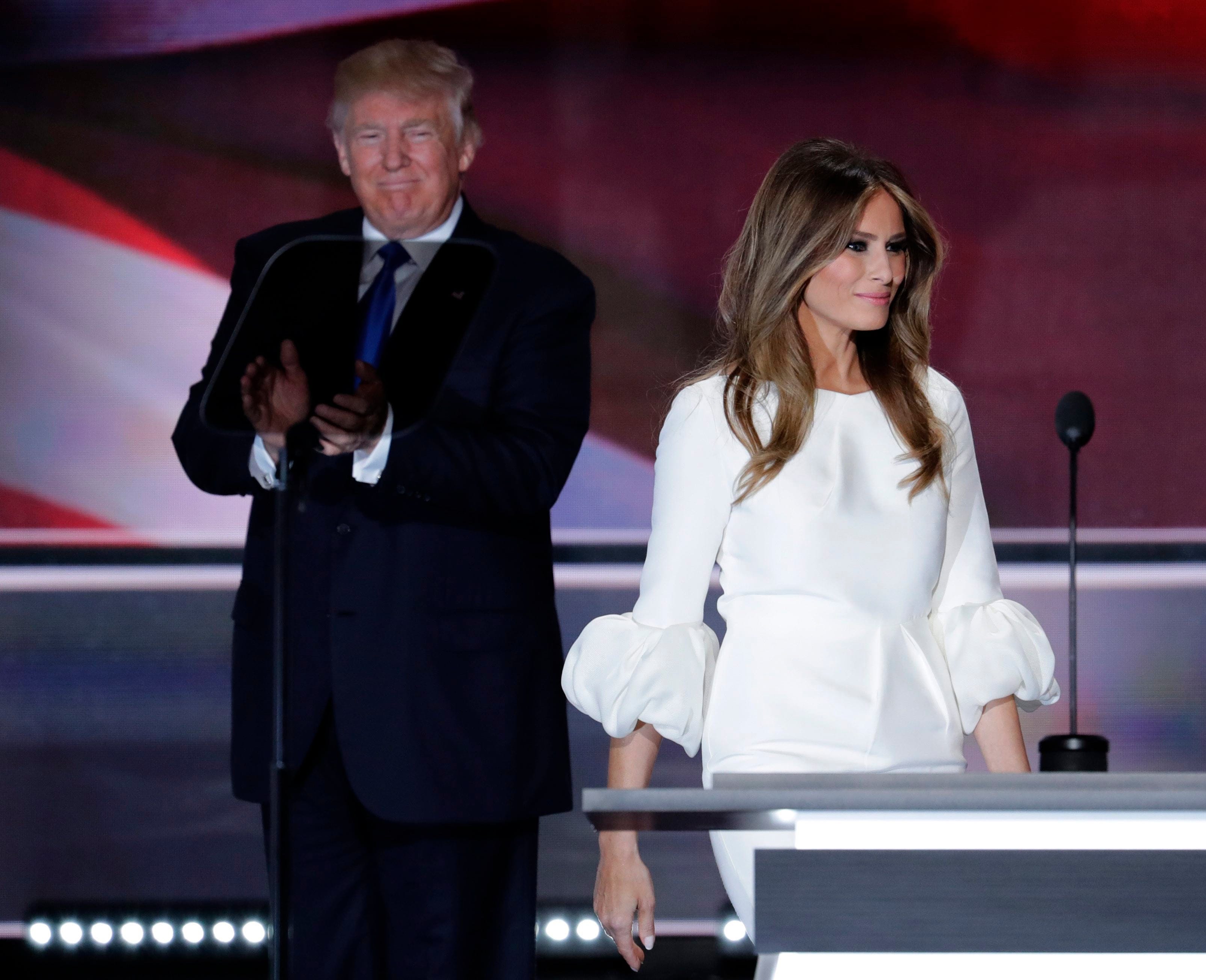 Melania Trump, wife of Republican Presidential Candidate Donald Trump walks to the stage as Donald Trump applaudss during the opening day of the Republican National Convention in Cleveland, Monday, July 18, 2016. (AP Photo/J. Scott Applewhite)