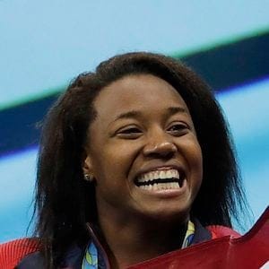 United States' Simone Manuel celebrates winning the gold medal in the women's 100-meter freestyle during the swimming competitions at the 2016 Summer Olympics, Friday, Aug. 12, 2016, in Rio de Janeiro, Brazil. (AP Photo/Natacha Pisarenko)