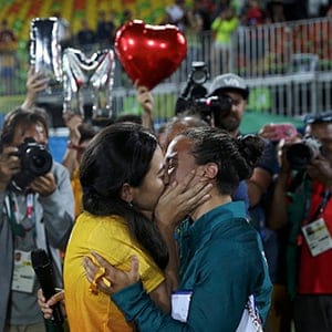Rugby player Isadora Cerullo (BRA) of Brazil kisses Marjorie, a volunteer, after receiving her wedding proposal on the sidelines of the women's rugby medal ceremony. (Alessandro Bianchi/Reuters)