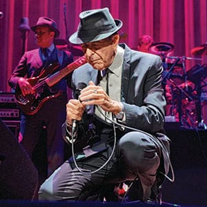 Leonard Cohen performs on stage at Leeds Arena on September 7, 2013 in Leeds, England. (Gary Wolstenholme/Redferns/Getty Images)