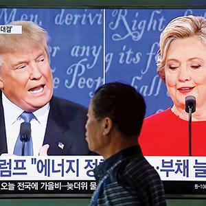 A man walks past a TV broadcast of the first presidential debate between U.S. Democratic presidential candidate Hillary Clinton and Republican presidential nominee Donald Trump, in Seoul, South Korea, September 27, 2016. (Kim Hong-Ji/Reuters)