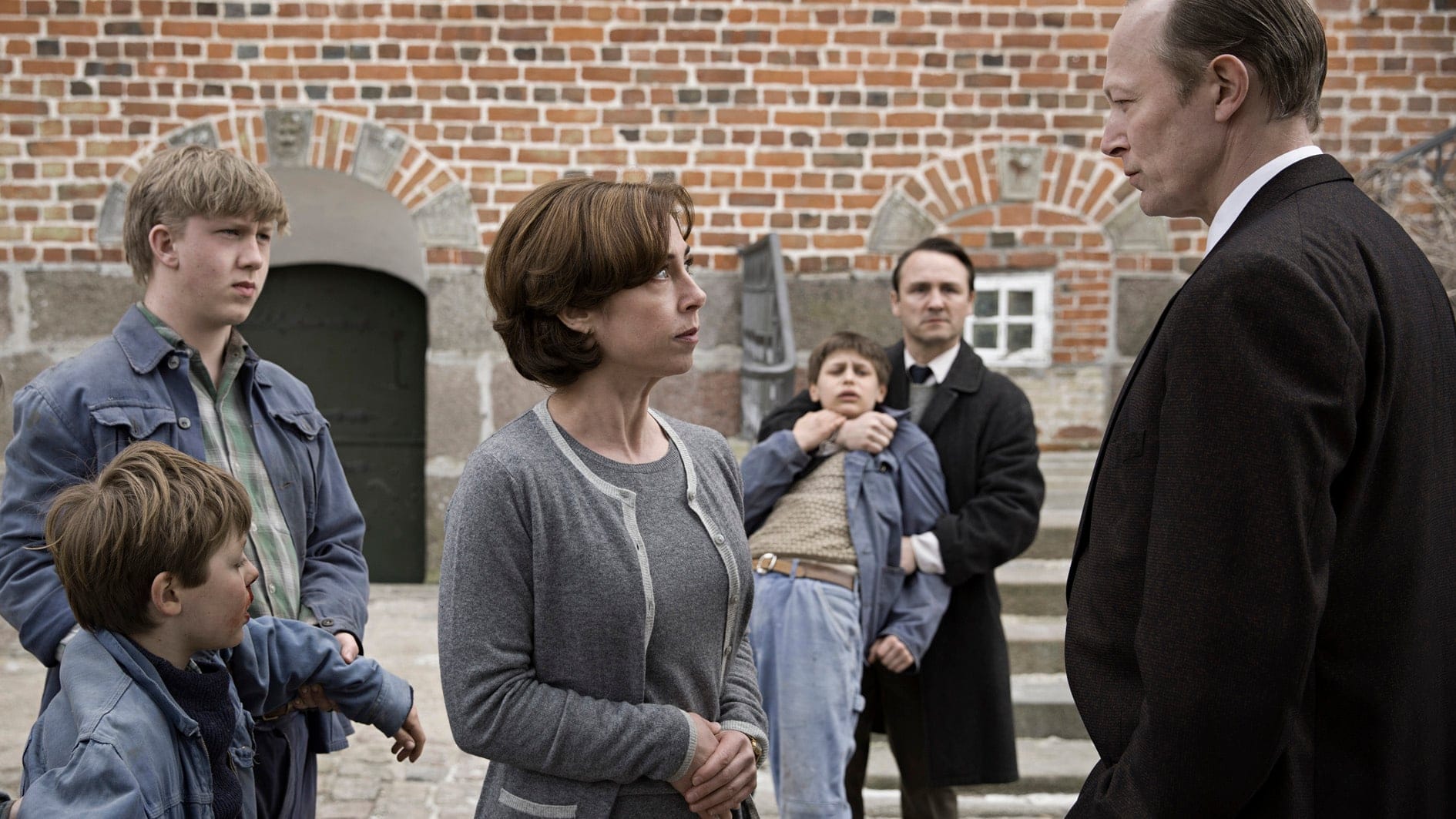 A scene from "The Day Will Come, with Harald Hermann (lower left), Sofie Gråbøl, Albert Lindhardt and Lars Mikkelsen / photo by Christian Geisnaes, courtesy Trust Nordisk