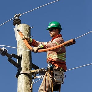 Algonquin College second year power line technician student Jarrett Pit wears a vest developed by Algonquin College while doing training at the Hydro Ottawa training yards for Algonquin College. (Jana Chytilova)