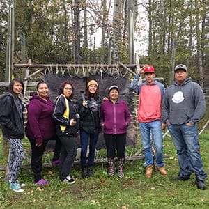 Portage College students learning hide tanning