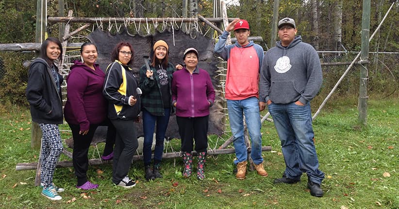 Portage College students learning hide tanning