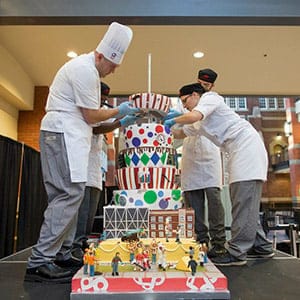 SAIT students with giant cake