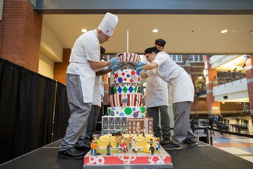 SAIT students with giant cake