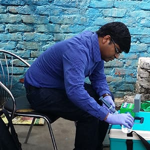Naga Siva Gunda, associate researcher at the Micro & Nano-scale Transport Laboratory in York University's Lassonde School of Engineering, is testing water for E. coli contamination at one of the field locations in Delhi, India. (York University)