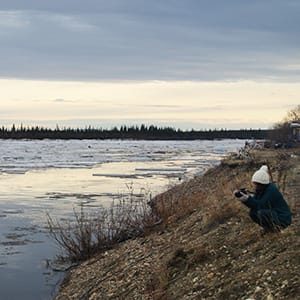 Yukon College art student studying climate change