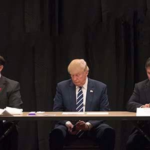 Donald Trump is interrupted by a phone call during a meeting with specialists on the problem of opiate addiction, after a campaign event in Manchester, N.H., Oct. 28, 2016. Trump on Friday seized on the FBI's announcement that it had uncovered new emails related to the investigation into whether Hillary Clinton had mishandled classified information. (Stephen Crowley/The New York Times/Redux)
