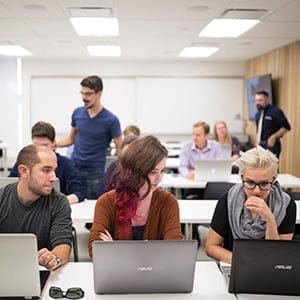 Students working on their computers at Laurentian University. (Photograph by Nick Iwanyshyn)