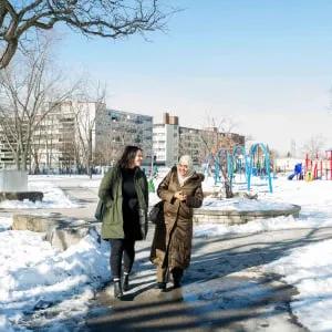 Thorncliffe Park Women's Committee chair Sabina Ali and second yr UofT urban planning student Stephanine Cirnu discuss change and improvent possibilities on community developments in the RV Burgess park in Toronto, ON. (Photograph by Cole Garside)