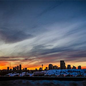 The sun sets as commuters head home in Calgary, Alta., Tuesday, Jan. 13, 2015. (THE CANADIAN PRESS IMAGES/Jeff McIntosh)