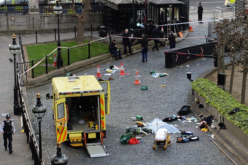 A body is covered by a sheet outside the Palace of Westminster, London, after a policeman was stabbed and his apparent attacker shot by officers in a major security incident at the Houses of Parliament. (Stefan Rousseau/PA Images/Getty Images)