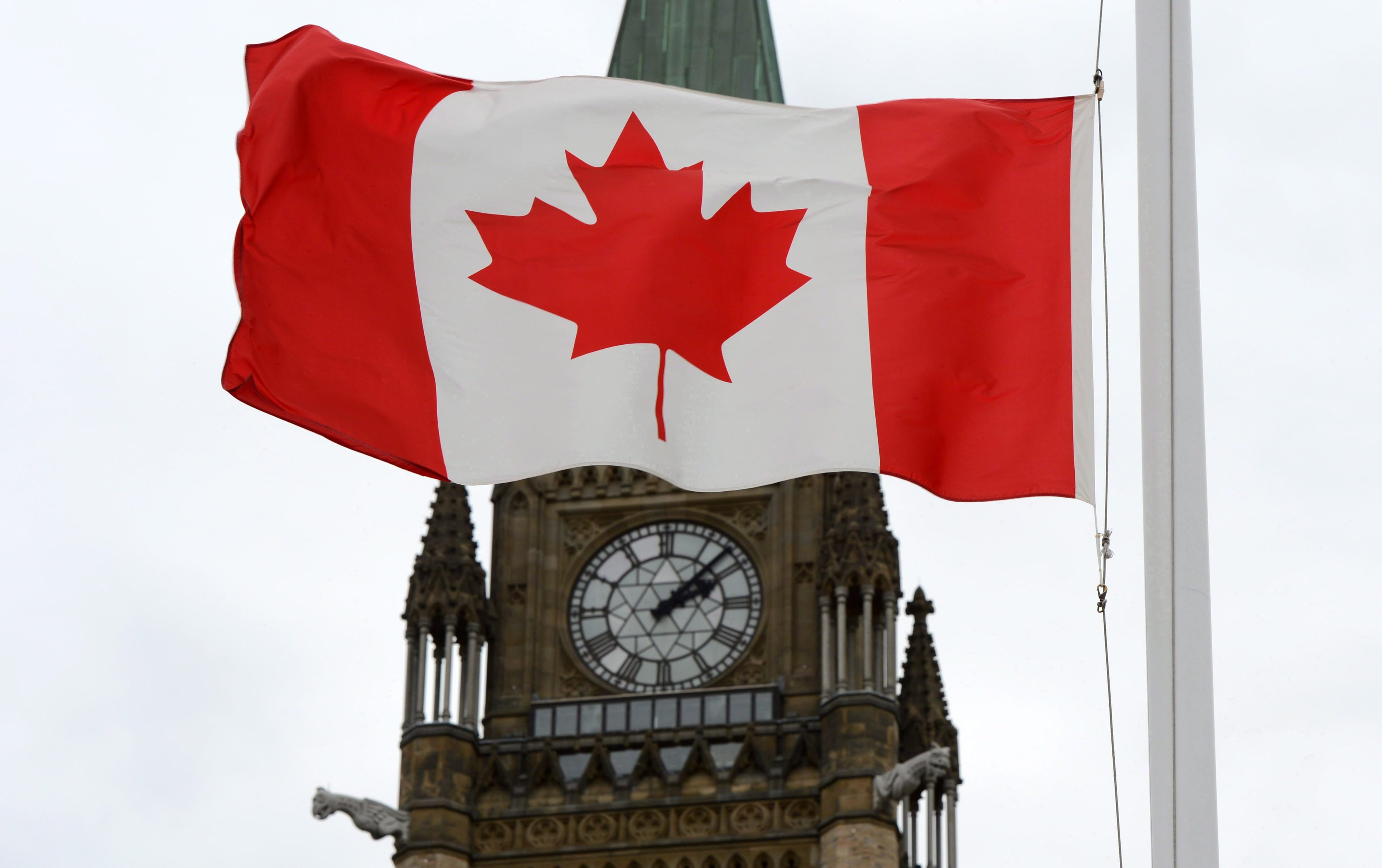 A Canadian flag blows in front of the Peace Tower on Parliament Hill in Ottawa, Ont., Wednesday, Oct. 24, 2012. (Sean Kilpatrick/CP)