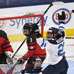 Finland's Noora Tulus (24) and Emma Nuutinen (22) celebrate the winning goal over Canada in the IIHF Ice Hockey Women's World Championship preliminary round game in Plymouth, Mich., on Saturday, April 1, 2017. (Jason Kryk/CP)
