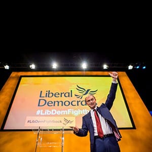 Leader of the Liberal Democrats party, Tim Farron, acknowledges the members of the audience after he delivered his keynote speech at the Liberal Democrats annual conference in the Bournemouth International Centre, southern England, Wednesday Sept. 23, 2015. Farron seized on the issue of Europe's migrant crisis, as he made his pitch to the public - and Lib Dem activists still reeling from the disastrous general election - that his party should return to government in 2020. (Ben Birchall/PA/AP/CP)