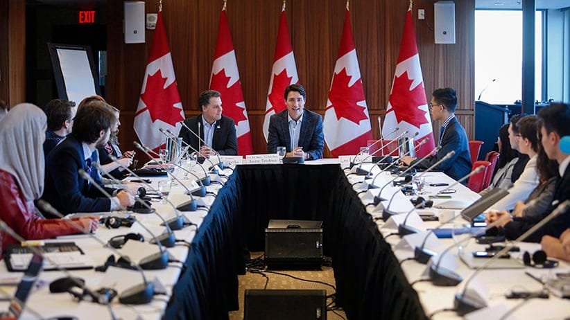 Prime Minister Justin Trudeau, centre, attends a meeting of the Prime Minister's Youth Council in Calgary on Wednesday, Jan. 25, 2017. (Jeff McIntosh/CP)