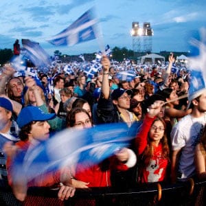 People celebrate the St-Jean Baptiste on the Plains of Abraham in Quebec City. The day is designated as a national holiday in Quebec province. (Mathieu Belanger/CP)