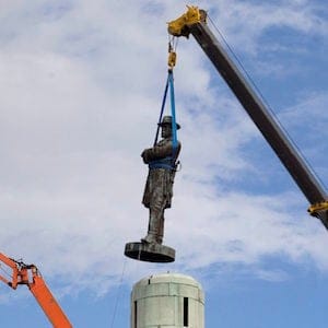 A statue of Confederate General Robert E. Lee is removed from Lee Circle Friday, May 19, 2017, in New Orleans. Lee's was the last of four monuments to Confederate-era figures to be removed under a 2015 City Council vote on a proposal by Mayor Mitch Landrieu. (AP Photo/Scott Threlkeld)