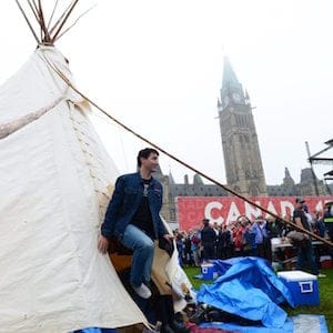 Prime Minister Justin Trudeau leaves a teepee on Parliament Hill in Ottawa on Friday, June 30, 2017. THE CANADIAN PRESS/Sean Kilpatrick