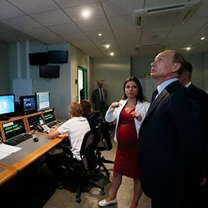 Russian President Vladimir Putin, right, visits the new headquarters of the "Russia Today" television channel in Moscow, Russia in June 2013