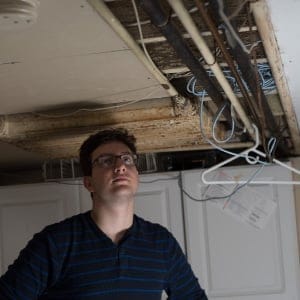 student housing: Jeremy Biro, a third year biology student at McMaster University, stands in the basement of his house in Hamilton, Ontario. Siro has issues with how his landlord neglects his house and the living conditions he is in.