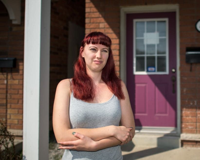 Student housing: Third year human resources student Allison Pirnat poses for a photo outside of her home near York University. Pirnat says the home has many problems, including a front door that cannot be locked from outside and rooms without windows. (Photograph, Andrew Lahodynskyj)