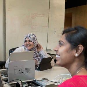 RovBOT immigration and visas: RovBOT co-founders, from left to right, Ruhi Madiwale, Dhivya Jayaraman, and JeyaBalaji Samuthiravelu work in the Shiftkey labs at Dalhousie University where they share the space with other companies on Monday, September 18, 2017. (Photograph by Darren Calabrese)