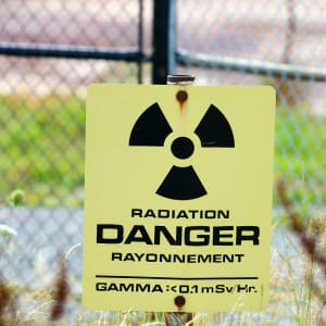 A radiation warning sign at the Port Granby Radioactive Waste management project in Clarington, Ont. on August 28, 2017. (Stephen C. Host/CP)