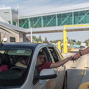 SWEETGRASS, MT - AUGUST 1: Trucks and cars entering the USA from Canada at the Customs and Border Protection Sweetgrass border crossing on Interstate 15 August 1, 2017 in Sweetgrass, Montana. 130,000 trucks and 260,000 passengers cars cross the border from Canada at Sweetgrass each year. (Photo by William Campbell-Corbis via Getty Images)
