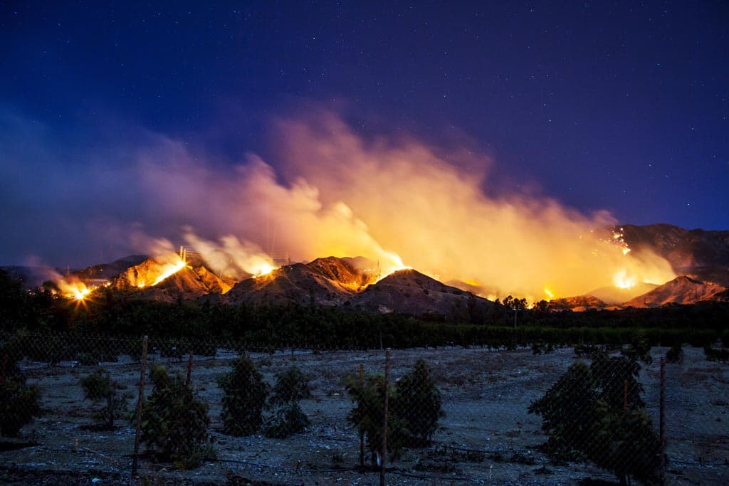 The Thomas Fire burns along a hillside near Santa Paula, California, on December 5, 2017. More than a thousand firefighters were struggling to contain a wind-whipped brush fire in southern California on December 5 that has left at least one person dead, sent thousands fleeing, and was choking the area with thick black smoke. (Kyle Grillot/AFP/Getty Images)