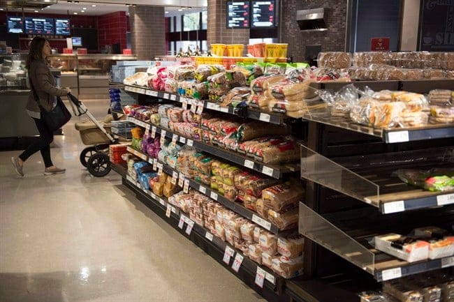 Various brands of bread sit on shelves in a grocery store in Toronto on Wednesday Nov. 1, 2017. The Competition Bureau's investigation into allegations of bread price fixing includes at least seven companies including Loblaw and Weston Bakeries, according to court documents. THE CANADIAN PRESS/Doug Ives