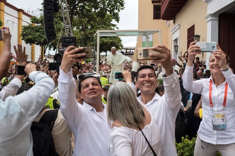 Colombian faithful take selfies as Pope Francis leaves San Pedro Claver church in Cartagena, Colombia on September 10, 2017. (Pedro Ugarte/AFP/Getty Images)