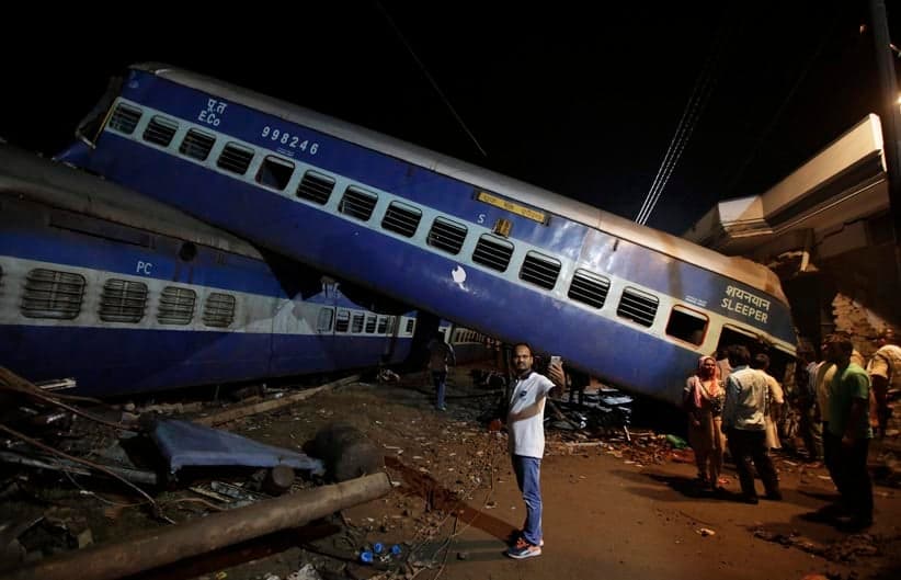 A man takes a selfie photo near the upturned coaches of the Kalinga-Utkal Express after an accident near Khatauli, in the northern Indian state of Uttar Pradesh, India, Sunday, Aug. 20, 2017. Several coaches of a passenger train derailed, causing fatalities and injuries in northern India on Saturday, officials said. (Altaf Qadri/AP)